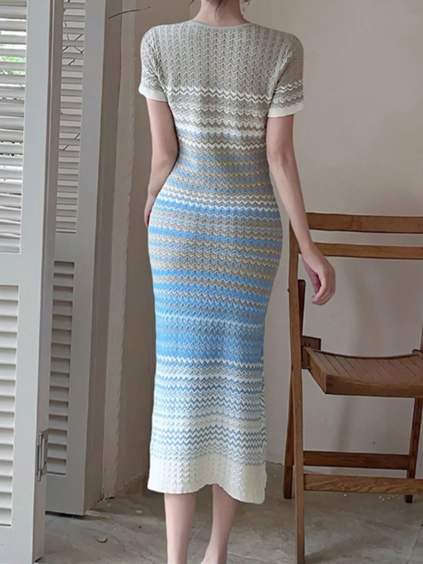 Light blue and cream knit striped midi dress from back, short sleeves and round neck