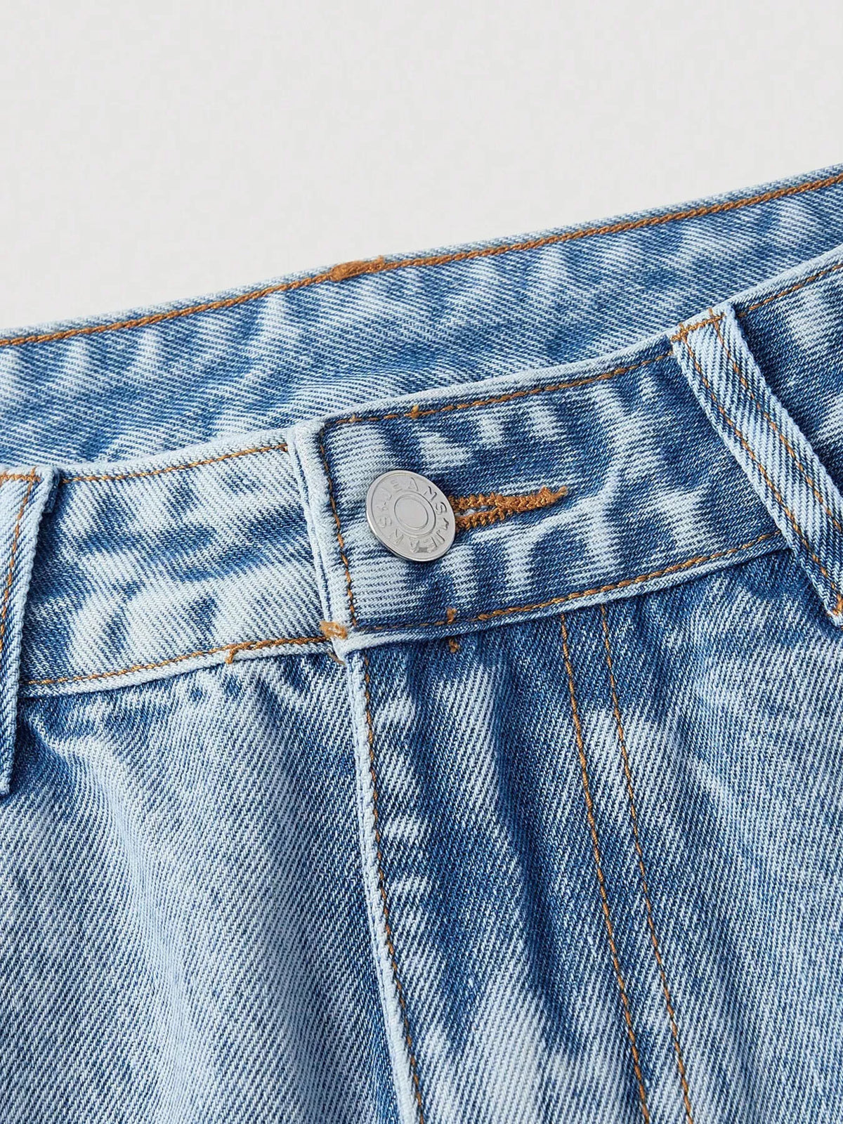 Light blue wide-leg jeans waistband with button closure and stitched coin pocket