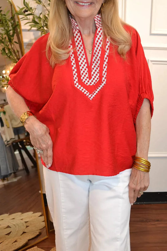 Red V-neck tunic blouse with plaid collar and short sleeves