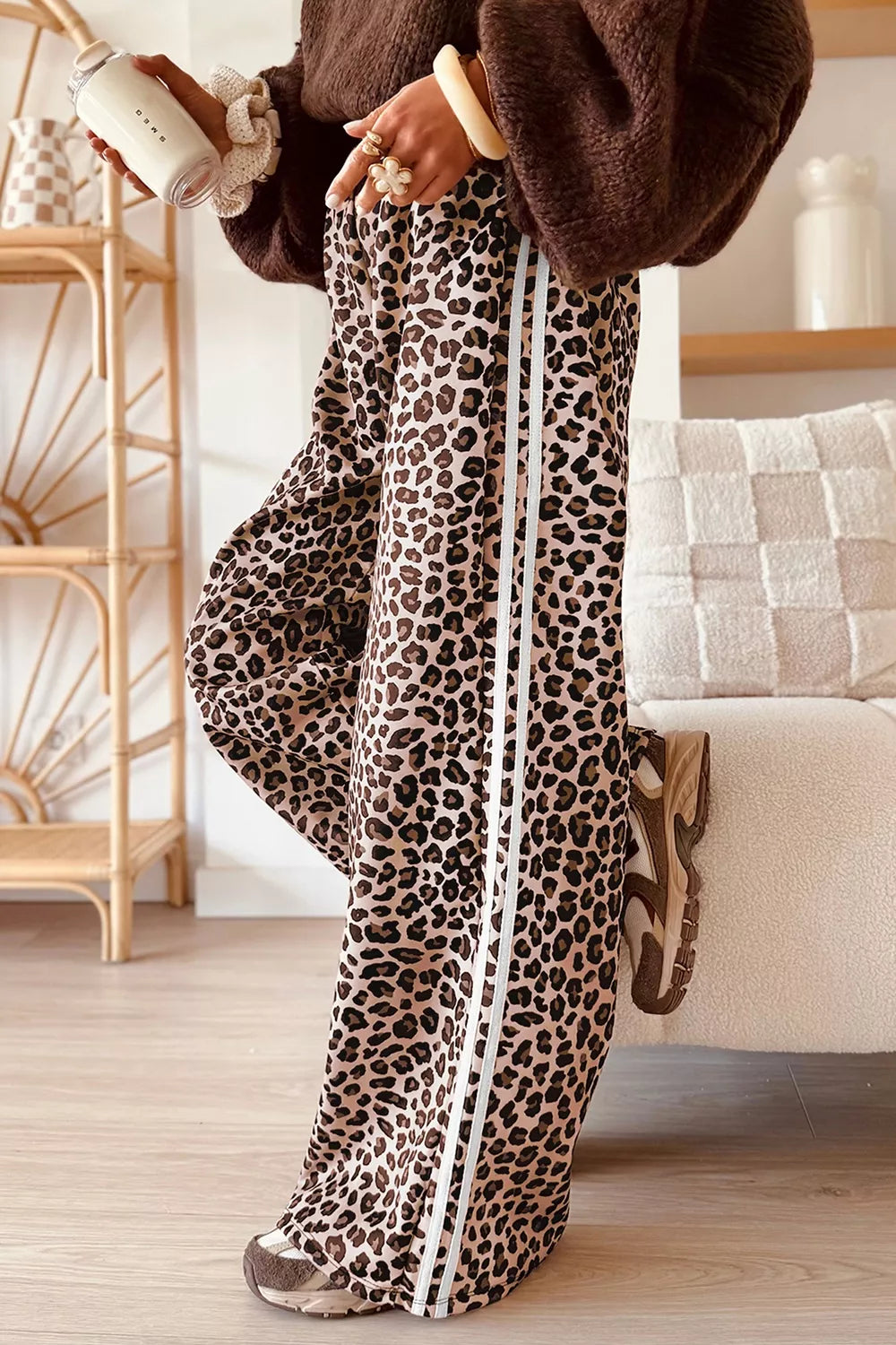 Leopard print wide-leg pants with black side stripe trim