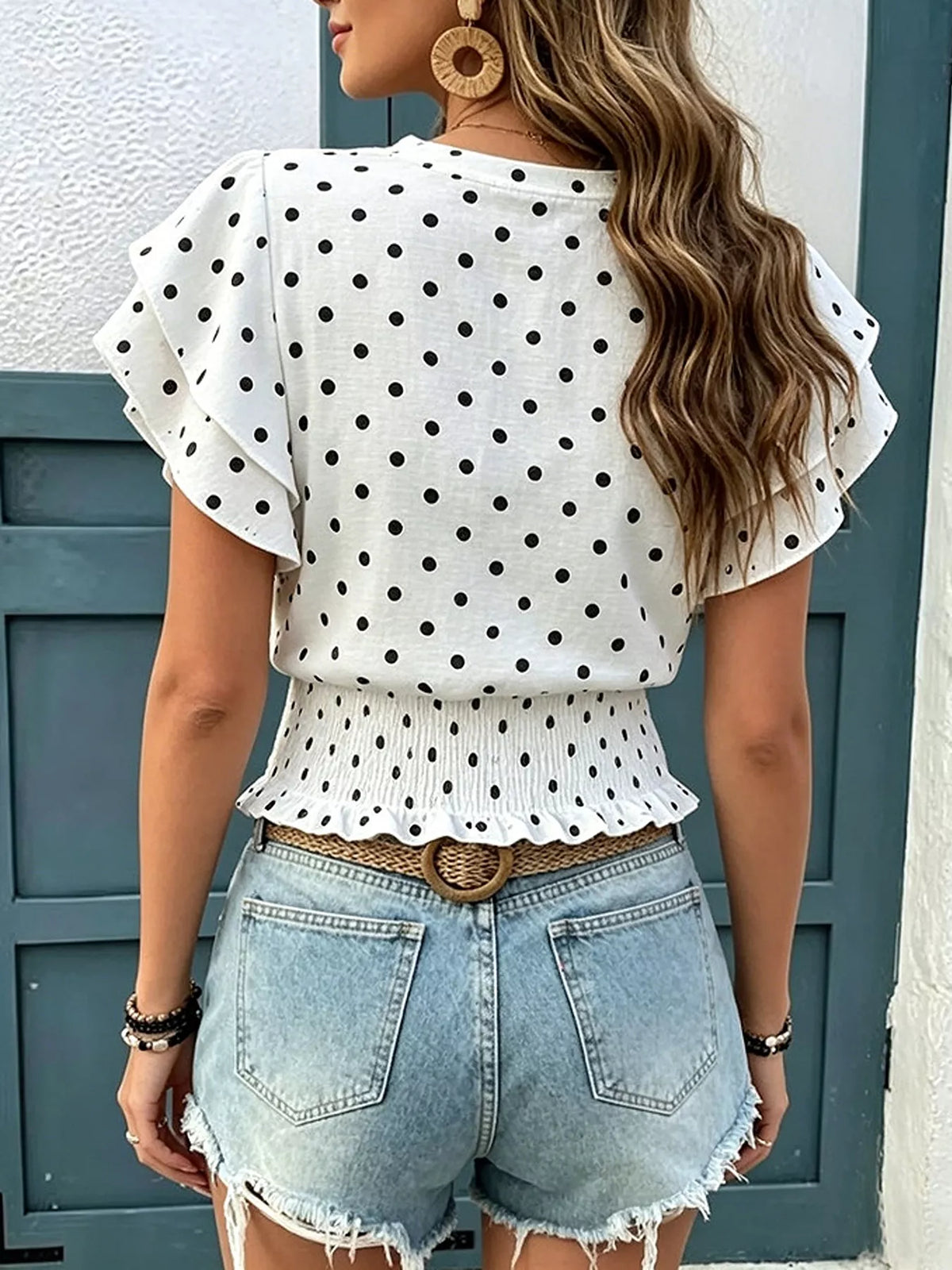 White polka dot blouse, flutter ruffle sleeves and gathered peplum waist