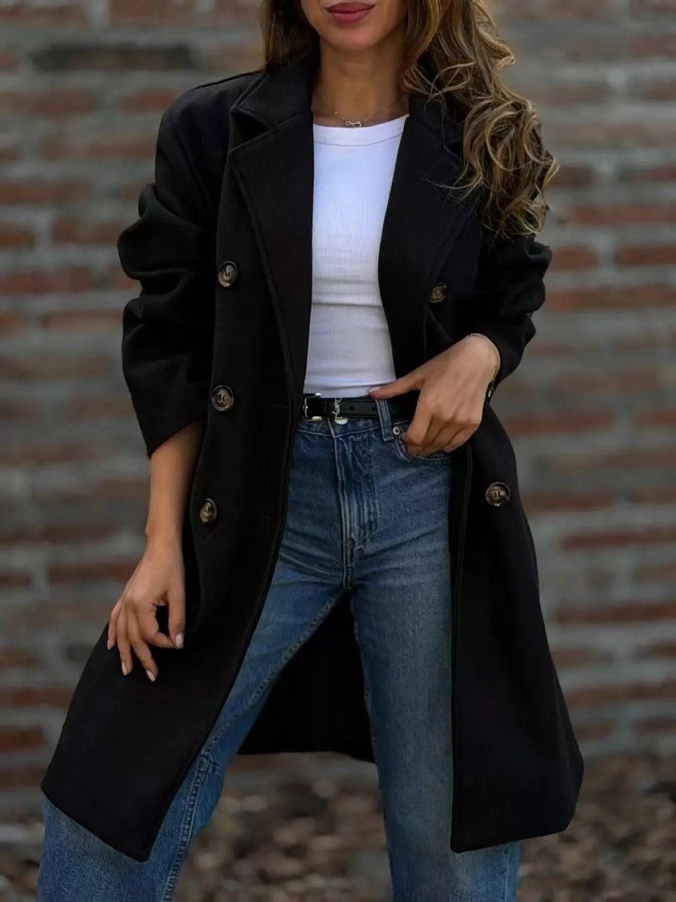Double-breasted lapel coat in black with gold buttons and knee-length cut