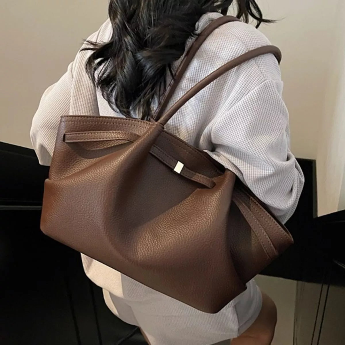 Brown PU leather shoulder bag with top handles and front flap clasp detail