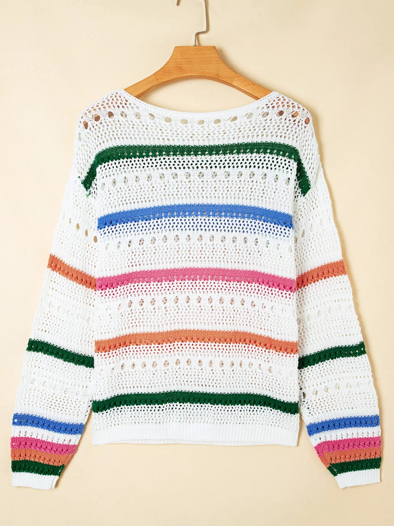 White pointelle knit sweater back with multicolor striped bands; openwork knit texture