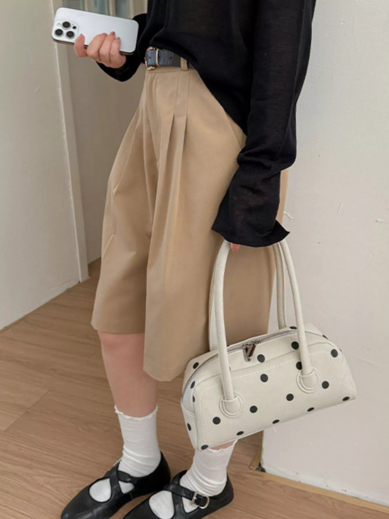 Off-white polka dot shoulder bag with top handles and structured front panel