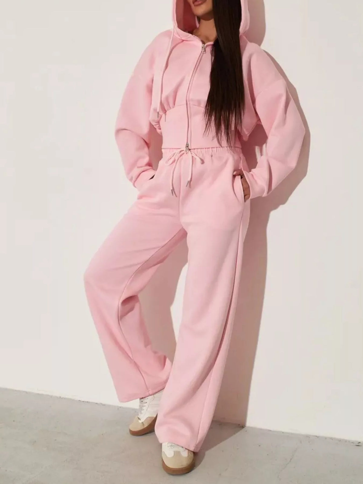 Pink zip-up hoodie and wide-leg pants set, angled front view with hood and elastic waistband