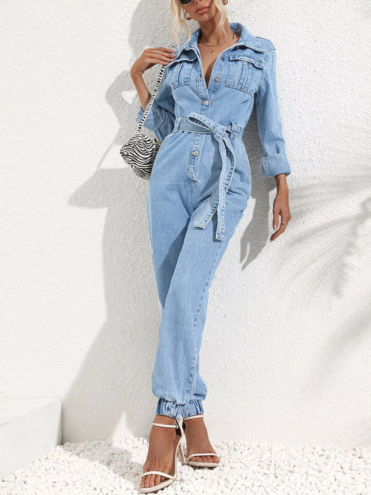 Medium blue denim button-front jumpsuit with waist tie belt, long sleeves