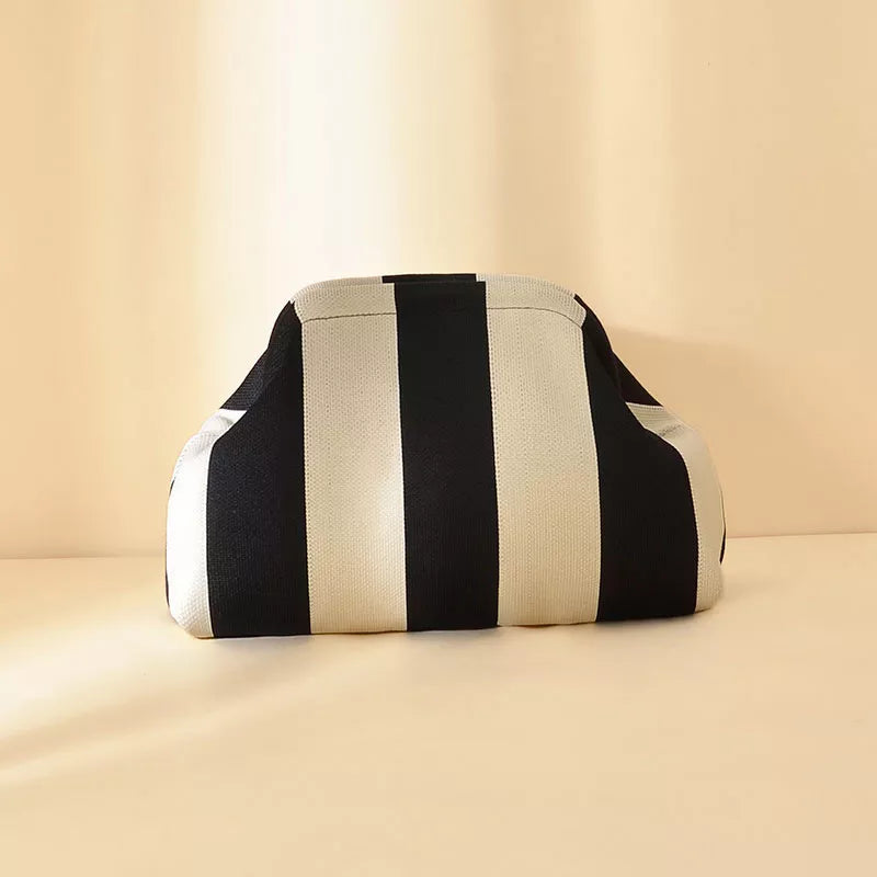 Black and white striped portable clutch with rounded top