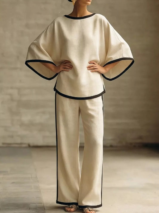 Cream plus size top and wide-leg pants set with black contrast trim, relaxed fit