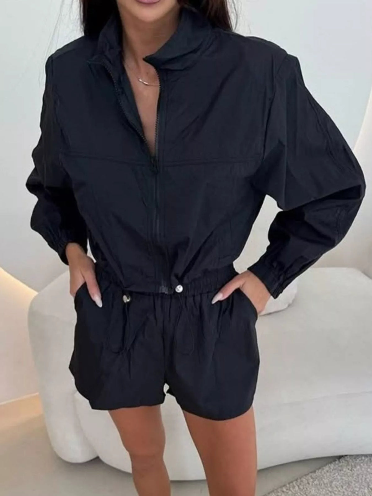 Black zip-front long sleeve outerwear and matching shorts set with elastic waist