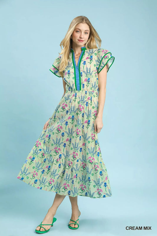 Cream floral midi dress with green trim, short ruffle sleeves, tiered skirt