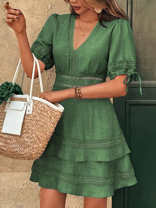Green lace-detail V-neck mini dress with tiered ruffle skirt and lace-trim sleeves