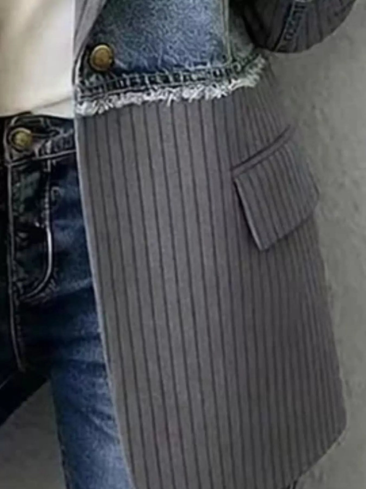 Patchwork ribbed blazer detail: dark gray striped front with denim side and pocket