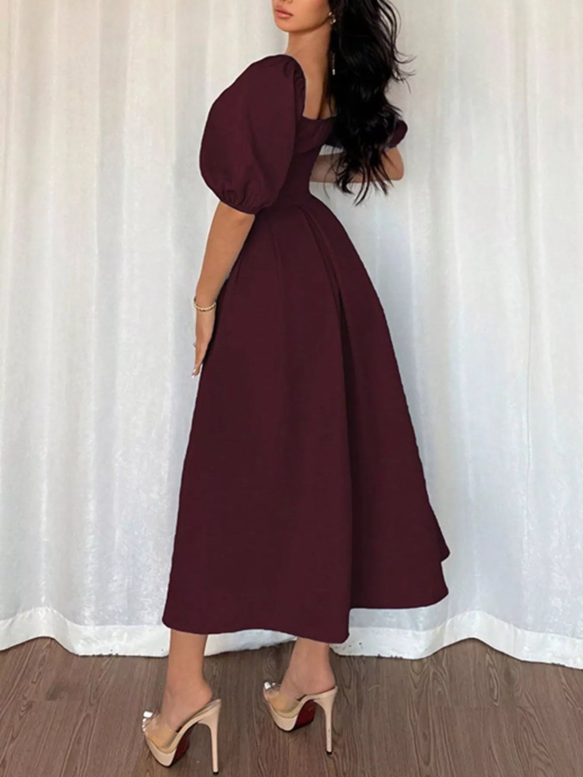 Burgundy square-neck flutter sleeve midi dress, side profile with puff sleeves and flared skirt