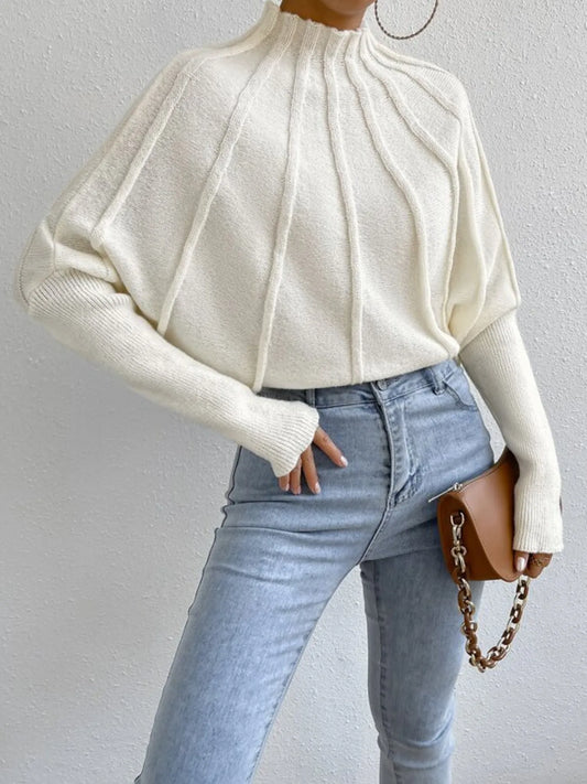 White mock neck ribbed sweater with gathered front yoke and long sleeves