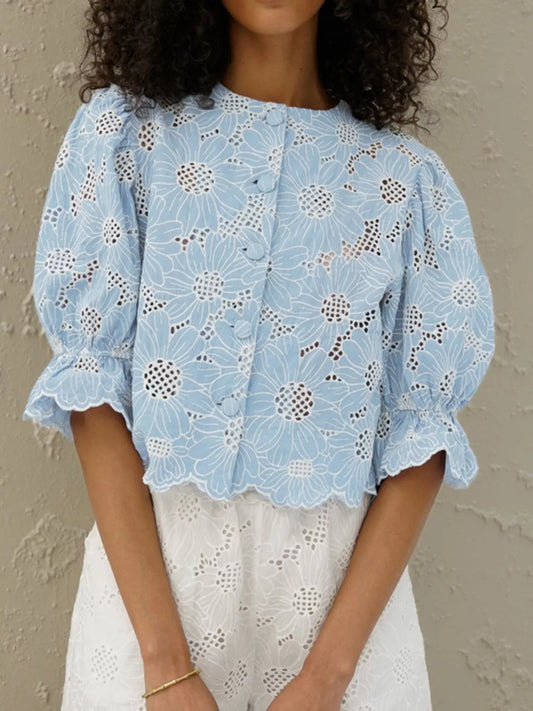 Light blue embroidered flounce sleeve blouse with eyelet floral motif and puff sleeves