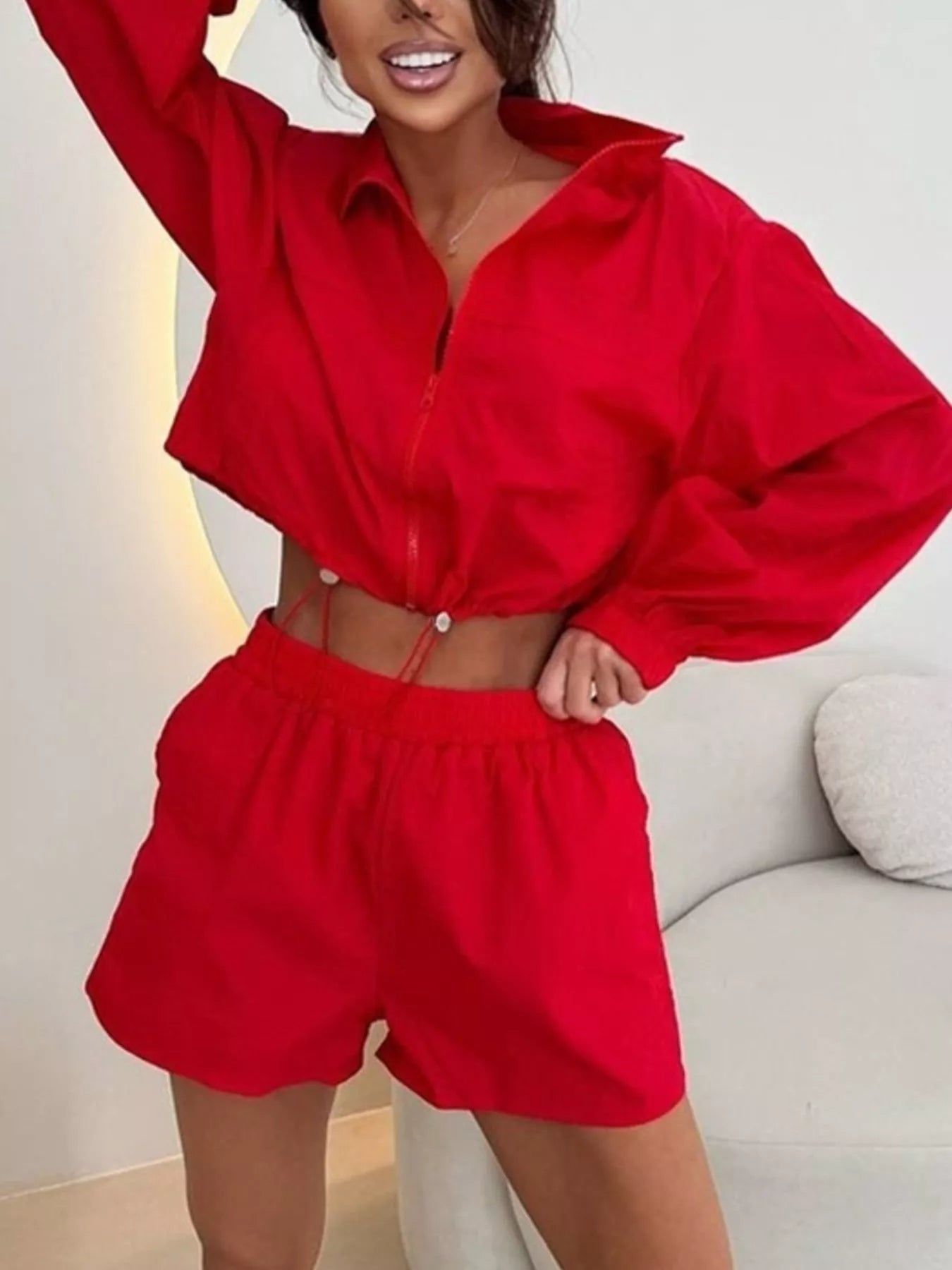 Red zip-up long-sleeve jacket and shorts set with drawstring waist, front view