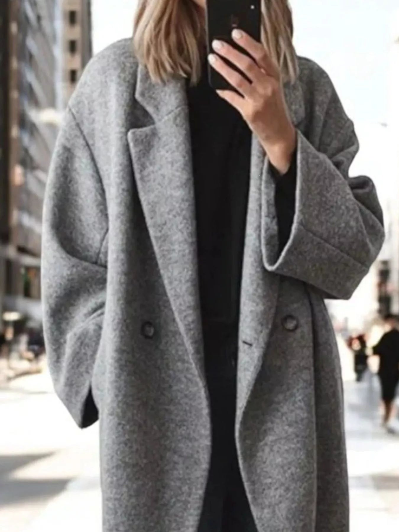 Light gray longline wool-blend coat with notch lapels and double-breasted button detail