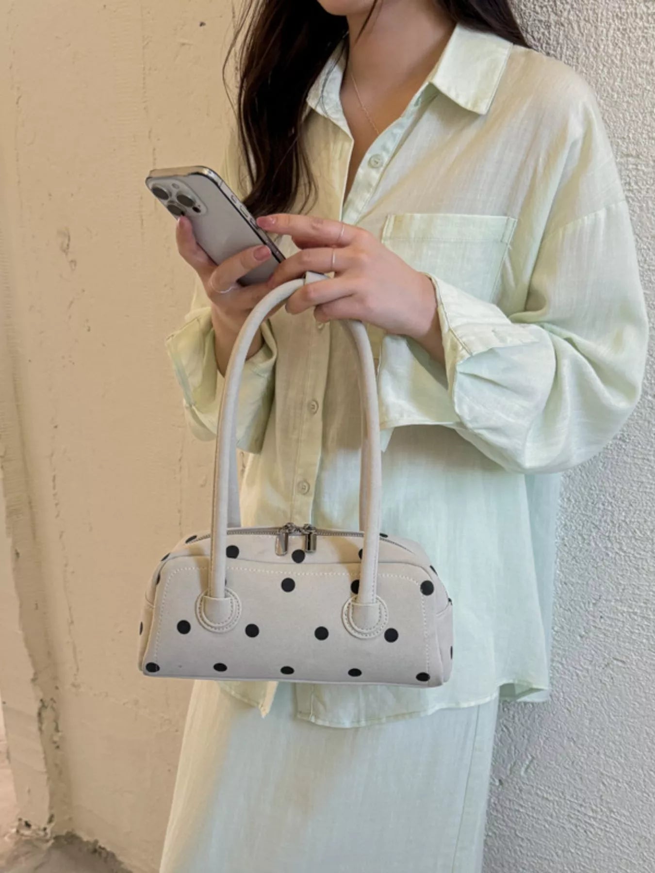 Off-white polka dot shoulder bag with double top handles and center clasp