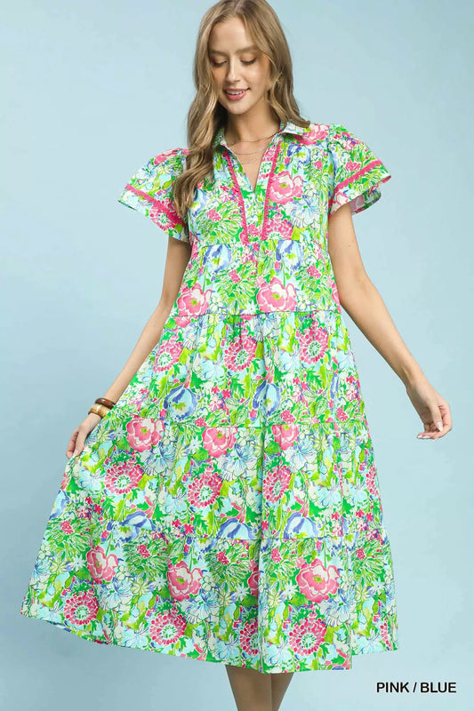 Tiered midi dress in mixed floral print with V-neck and layered tiered skirt.