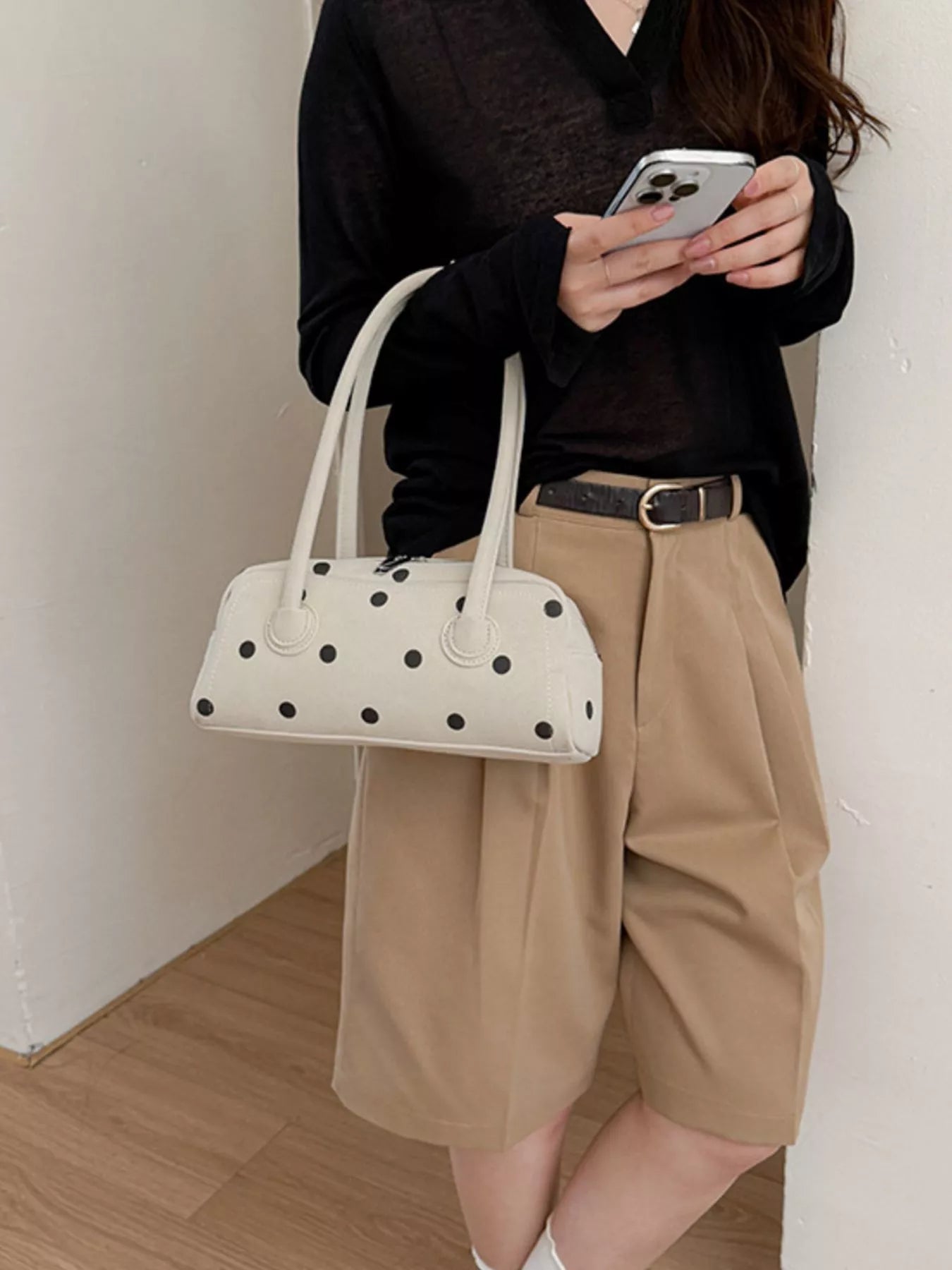 Off-white polka dot shoulder bag with top handles and structured front pocket