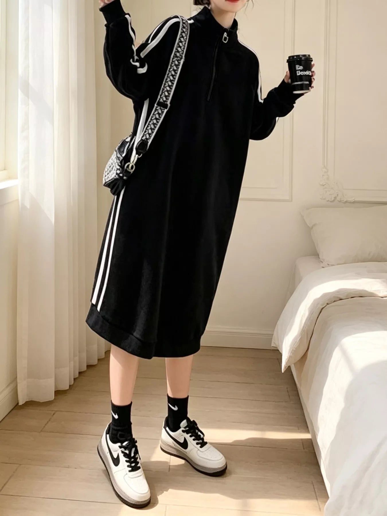 Black midi sweatshirt dress with quarter-zip mock neck and white side stripe details