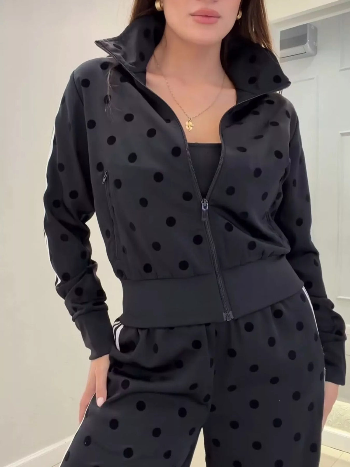 Black polka dot hooded zip-up jacket and matching pants set