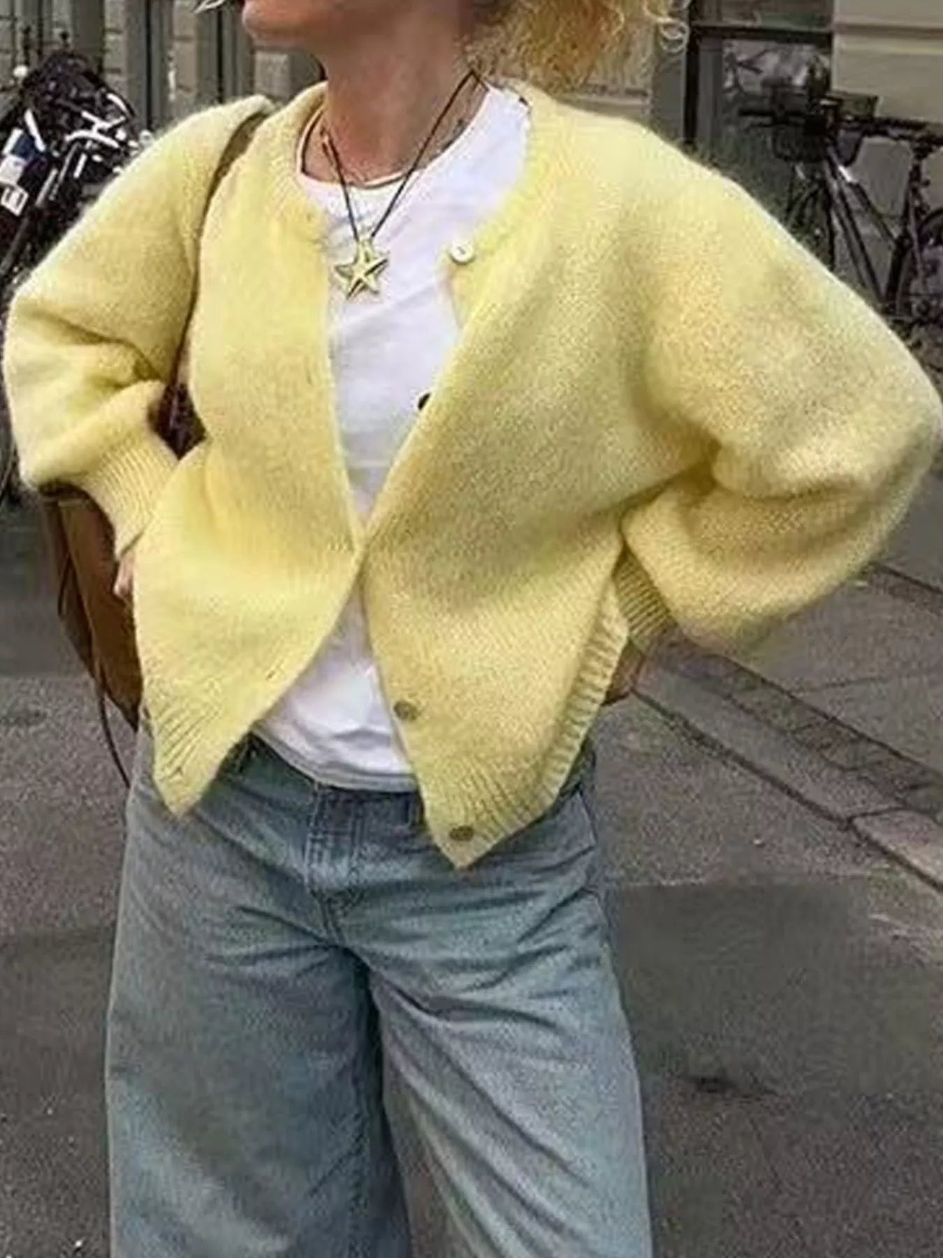 Yellow button-up long sleeve cardigan with V-neck front and small front buttons