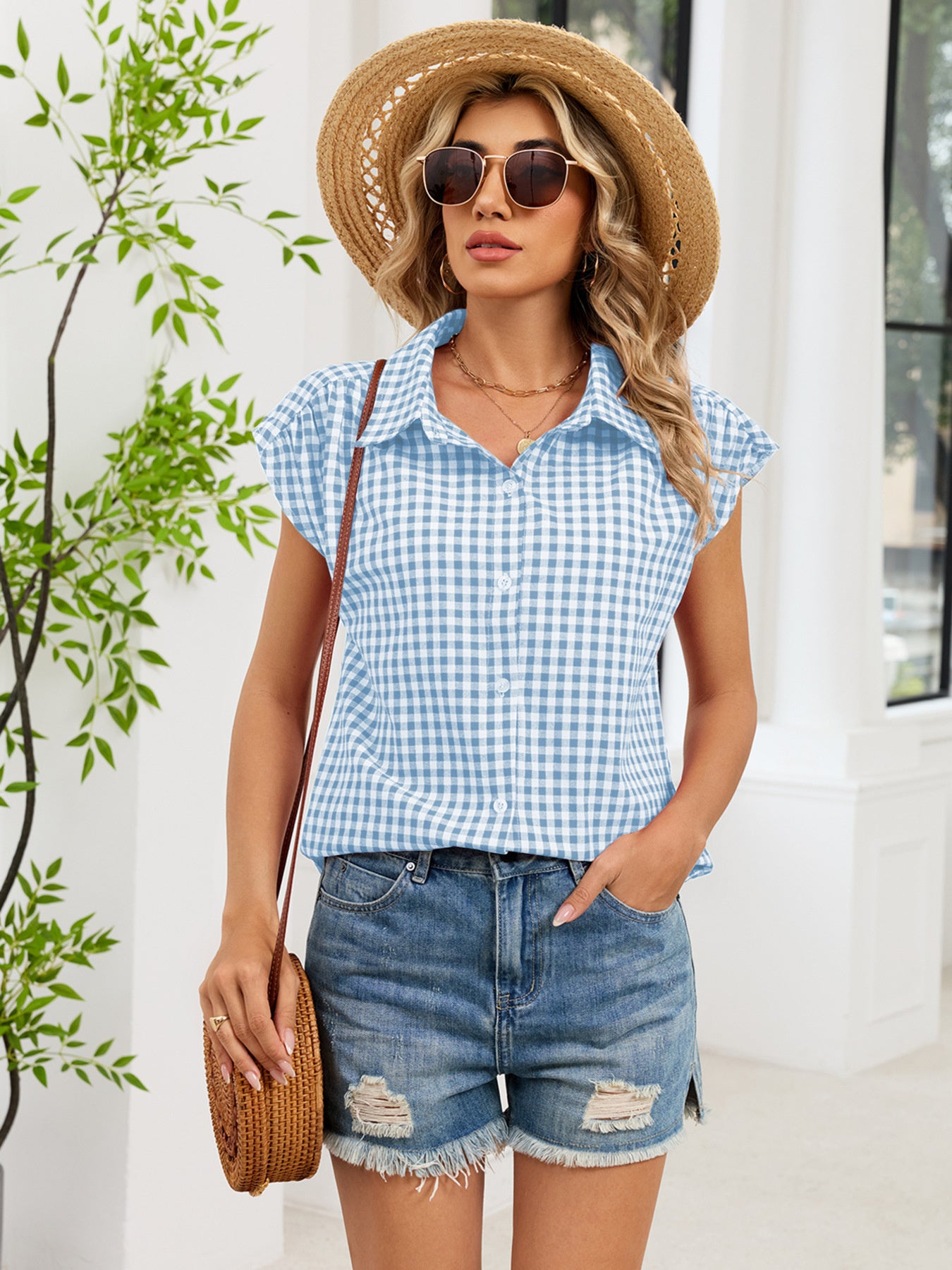 Blue and white plaid cap sleeve button-up shirt with collar and button front
