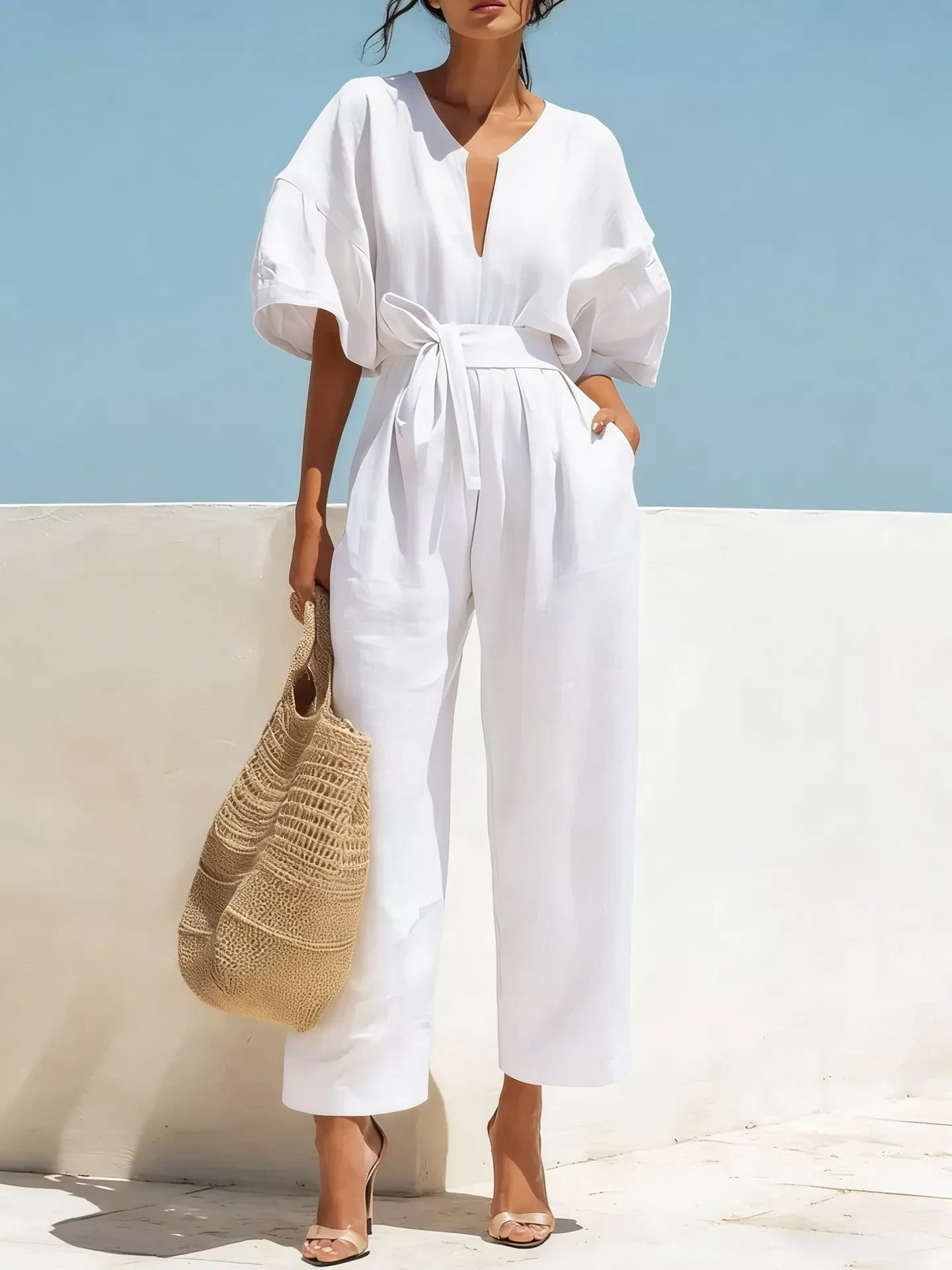 White tie-waist wide-leg jumpsuit with V-neck and short puff sleeves