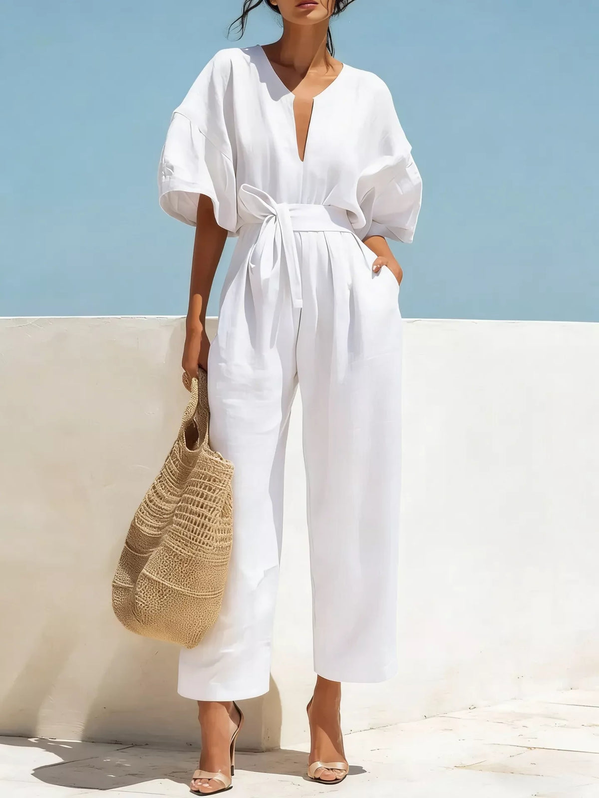 White tie-waist wide-leg jumpsuit with V-neck and short puff sleeves