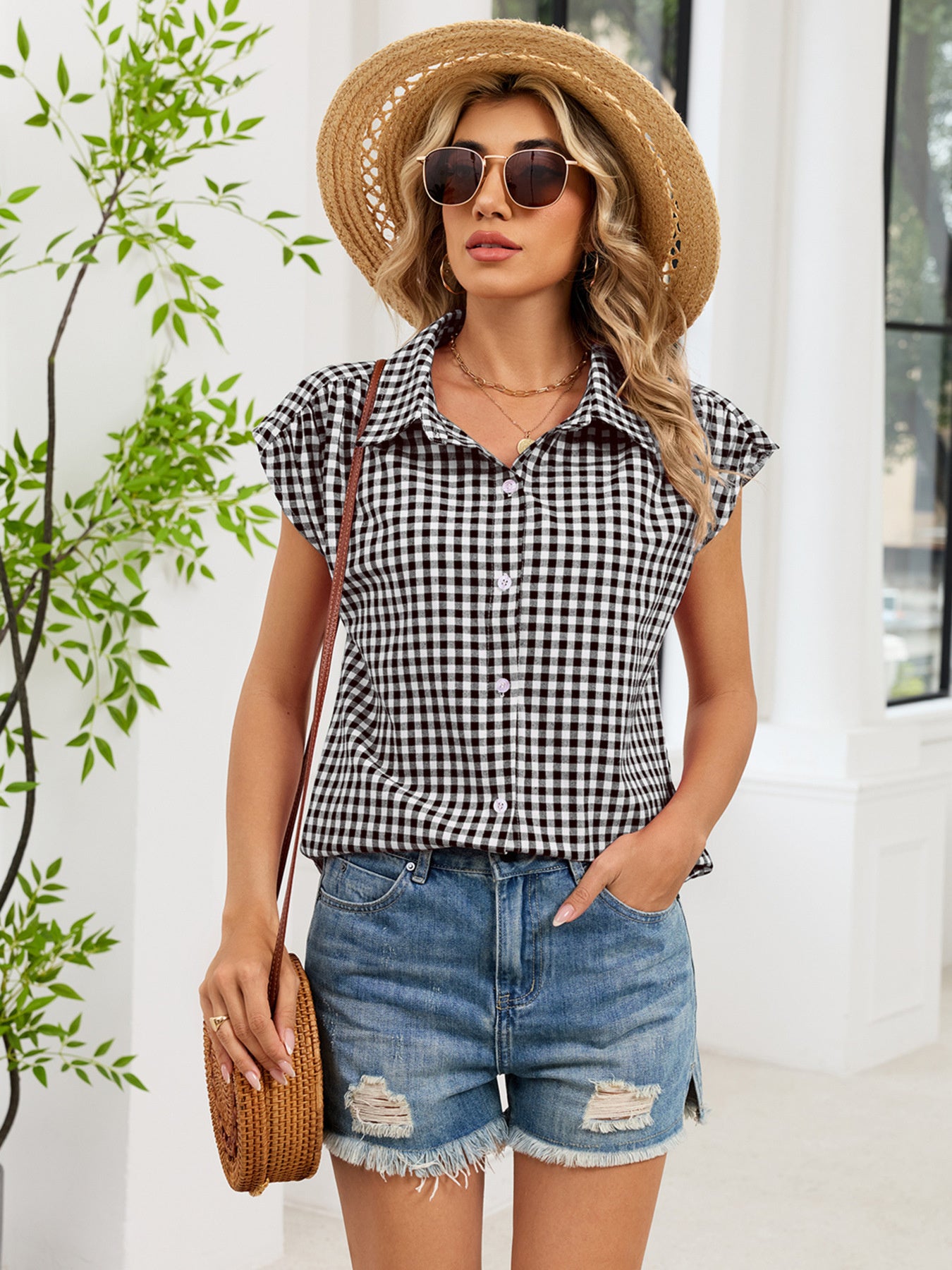 Black plaid cap-sleeve button-up shirt with collar and button placket