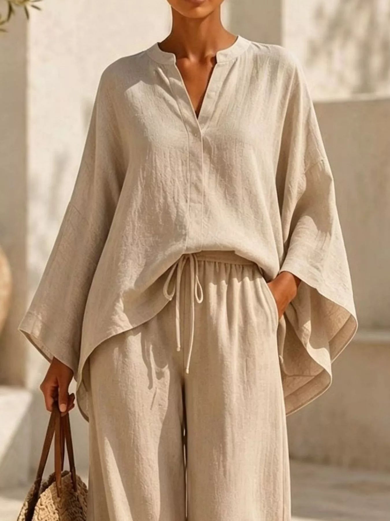 Plus-size notched long-sleeve top and wide-leg pants set in white, drawstring waist