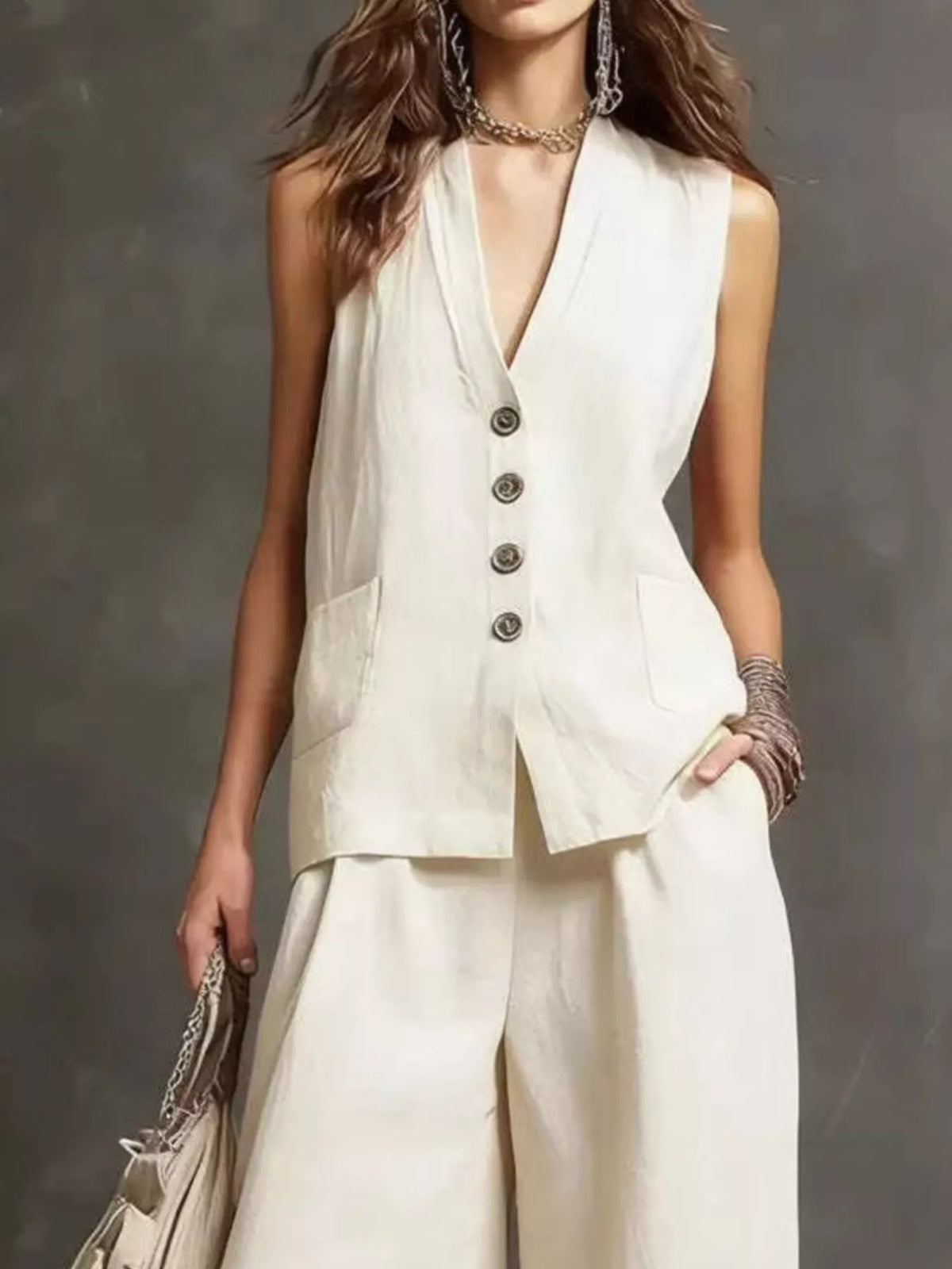 Cream sleeveless button-front vest and wide-leg pants set, close-up styling