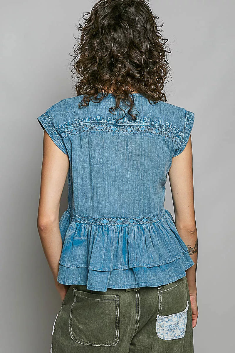 Denim blue sleeveless cotton blouse back view with pintuck detailing and peplum ruffle