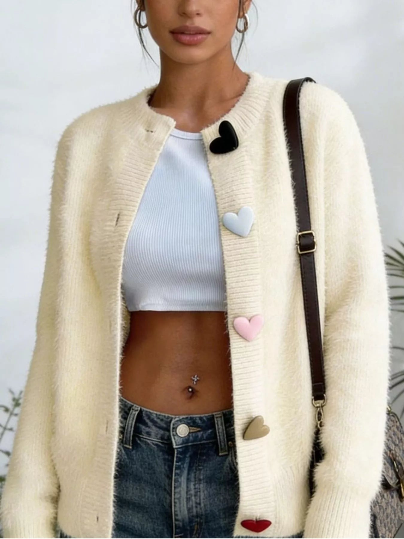 Cream fuzzy long-sleeve cardigan with button-front and heart-shaped trim
