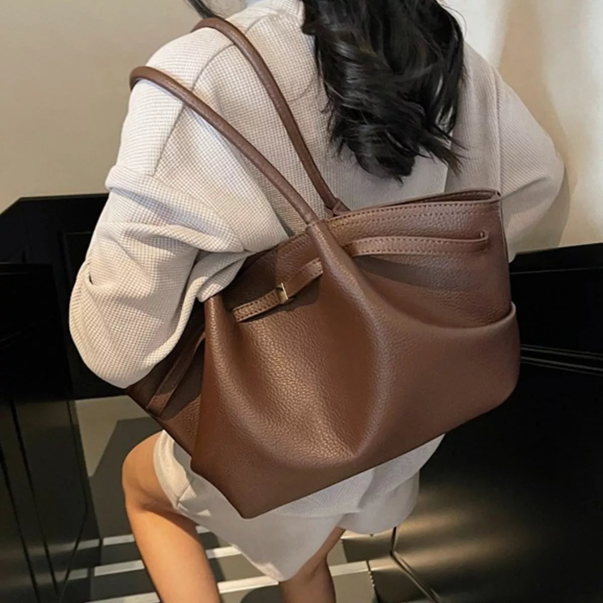 Brown PU leather shoulder bag with top handles and side gusset for roominess