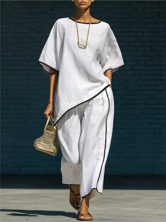 White round-neck top and loose pants set with black contrast trim along hem