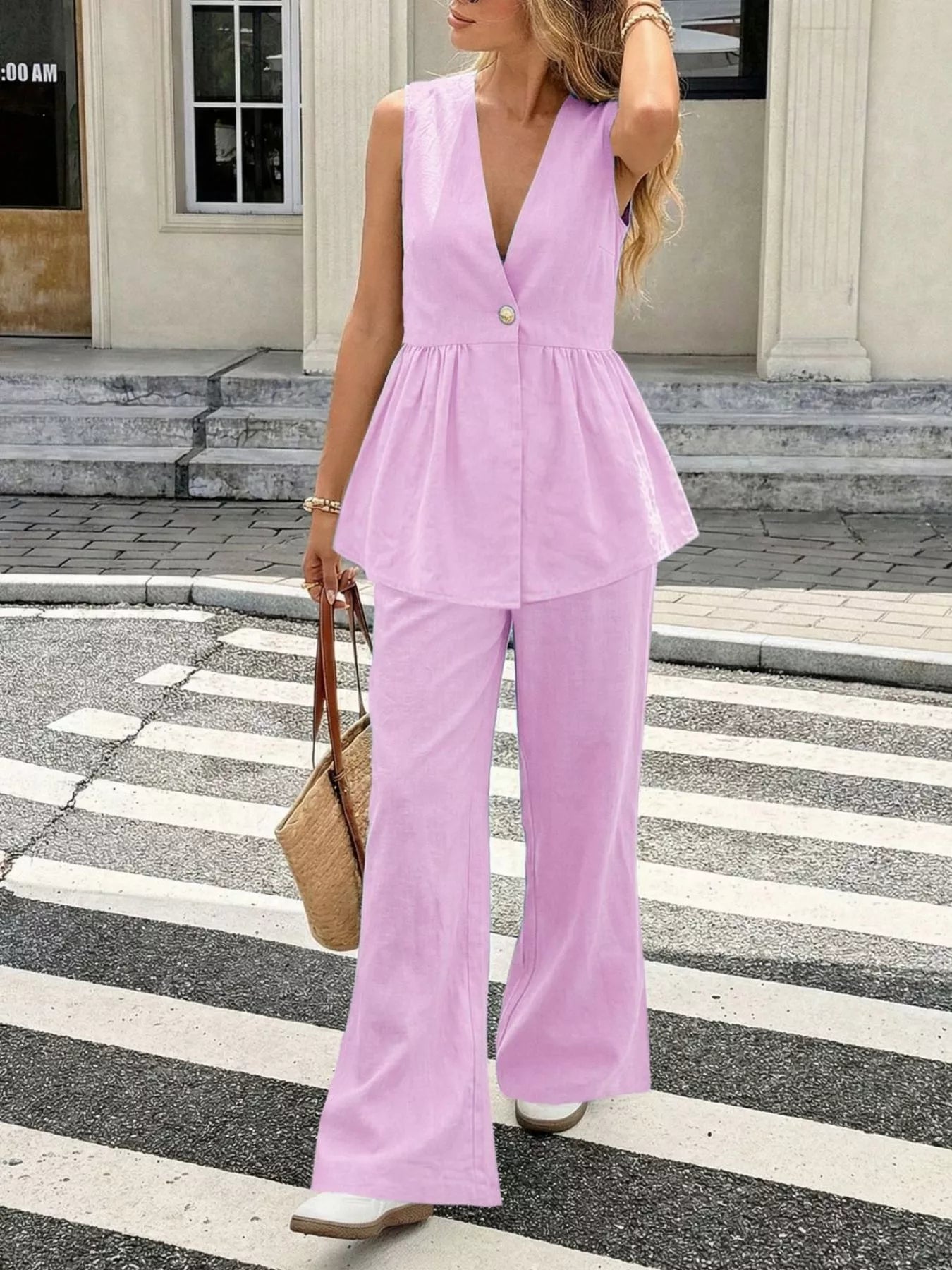 Pink V-neck sleeveless peplum top with wide-leg pants set, side view