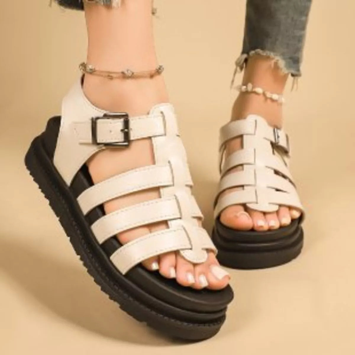 Off-white open-toe platform sandals with multiple straps and square buckle closure