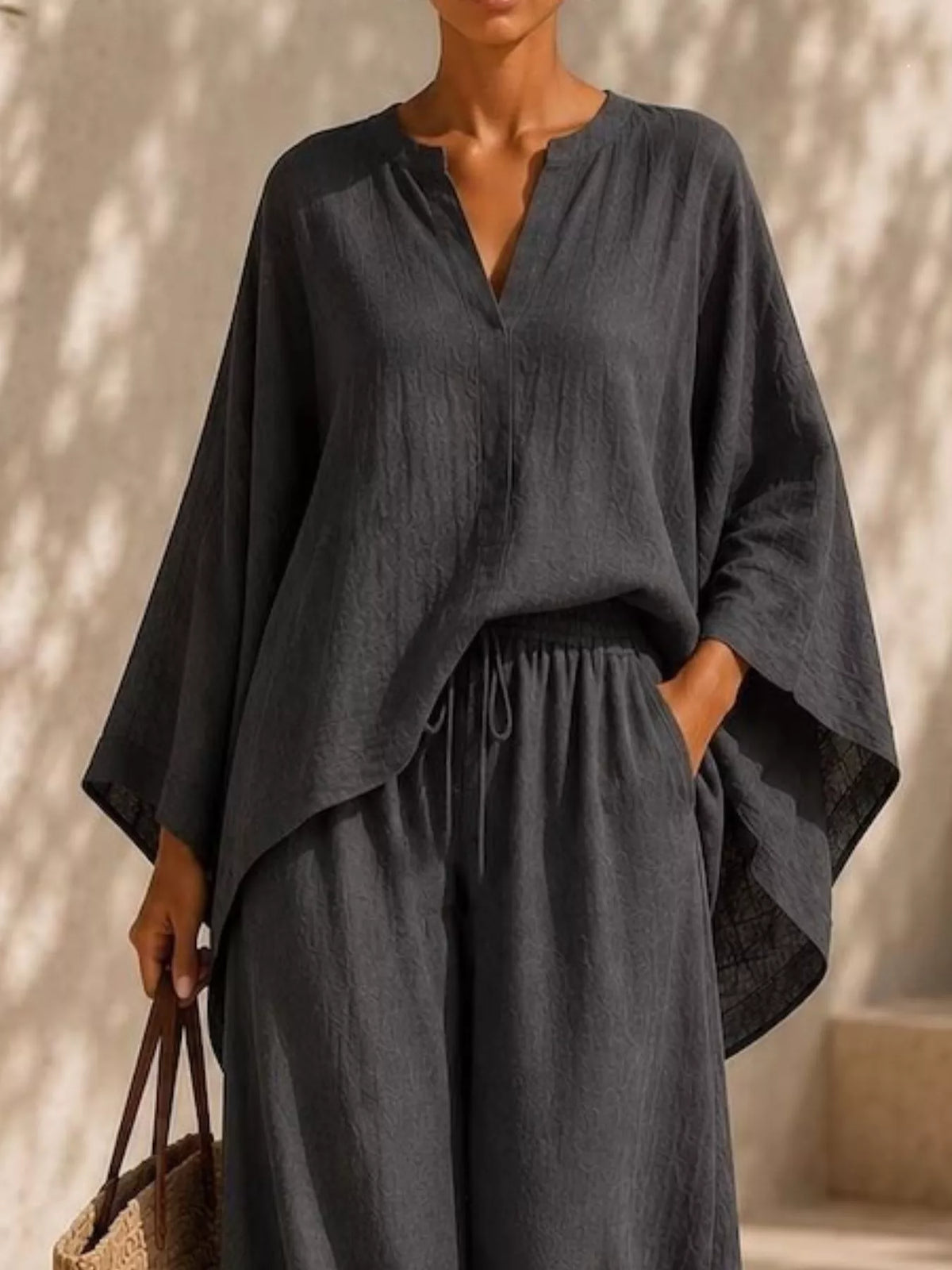 Plus-size notched long-sleeve top and wide-leg pants set in dark gray/black with V-neck