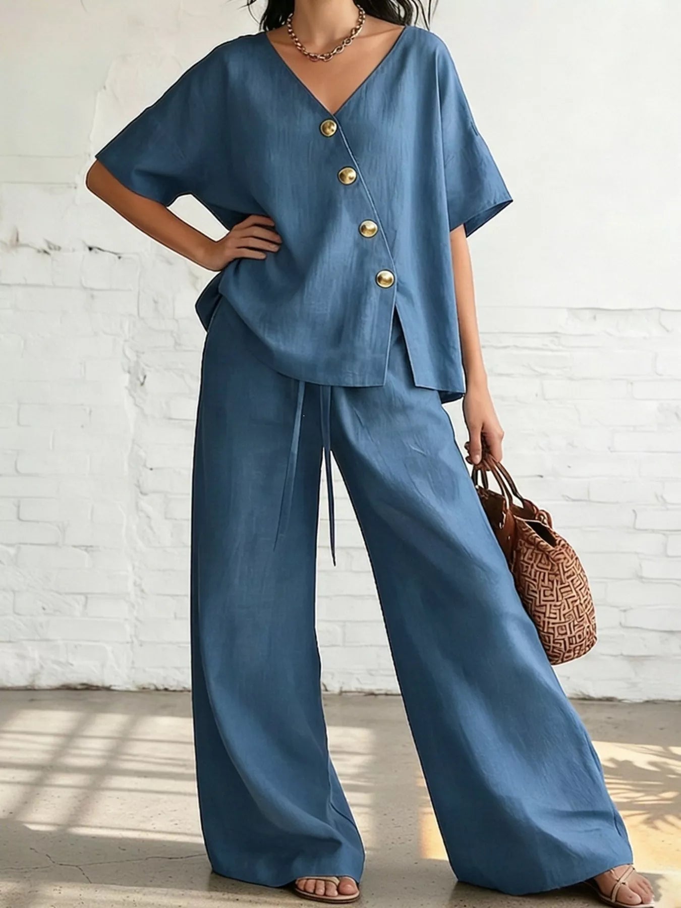 Blue plus size surplice half-sleeve top with button front and wide-leg pants