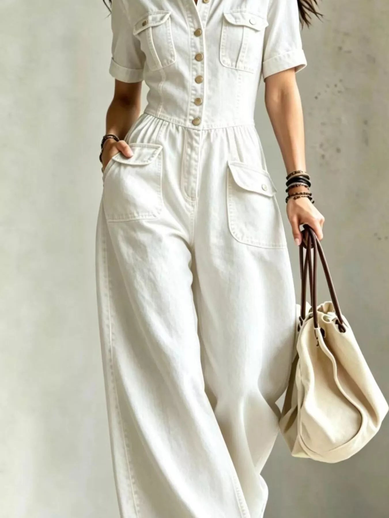 White denim wide-leg jumpsuit with chest pockets and front button placket