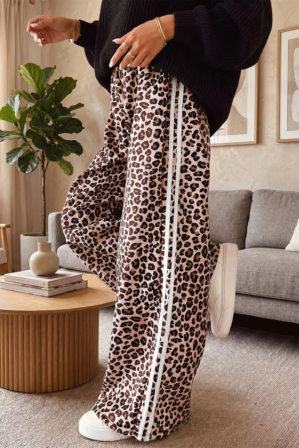 Leopard print wide-leg pants with black-and-white side stripes, full length