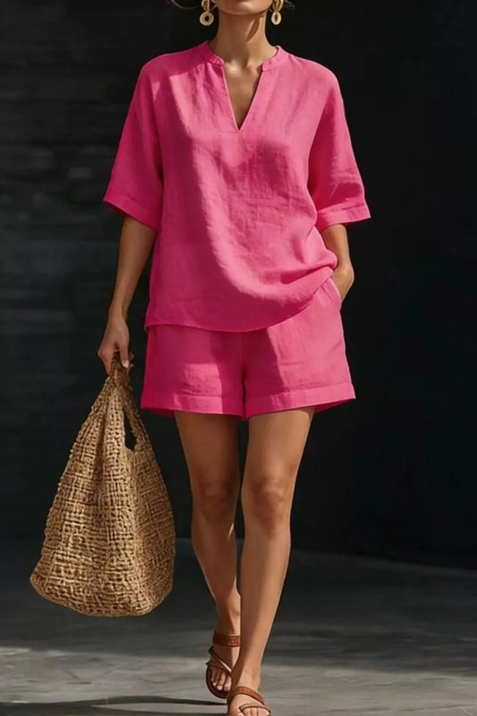 Hot pink notched half-sleeve top and matching shorts set, relaxed fit.
