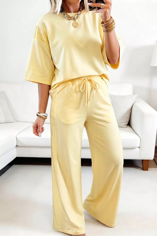 Pastel yellow half-sleeve top and drawstring pants set with eyelet accents