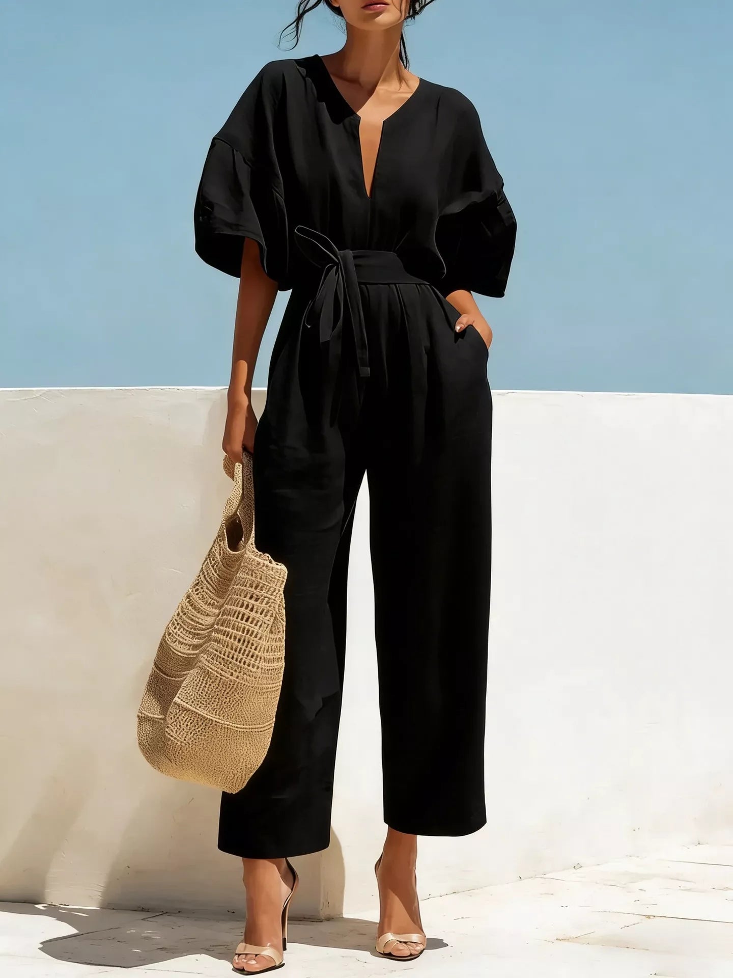 Black tie-waist wide-leg jumpsuit with V-neck and short puff sleeves