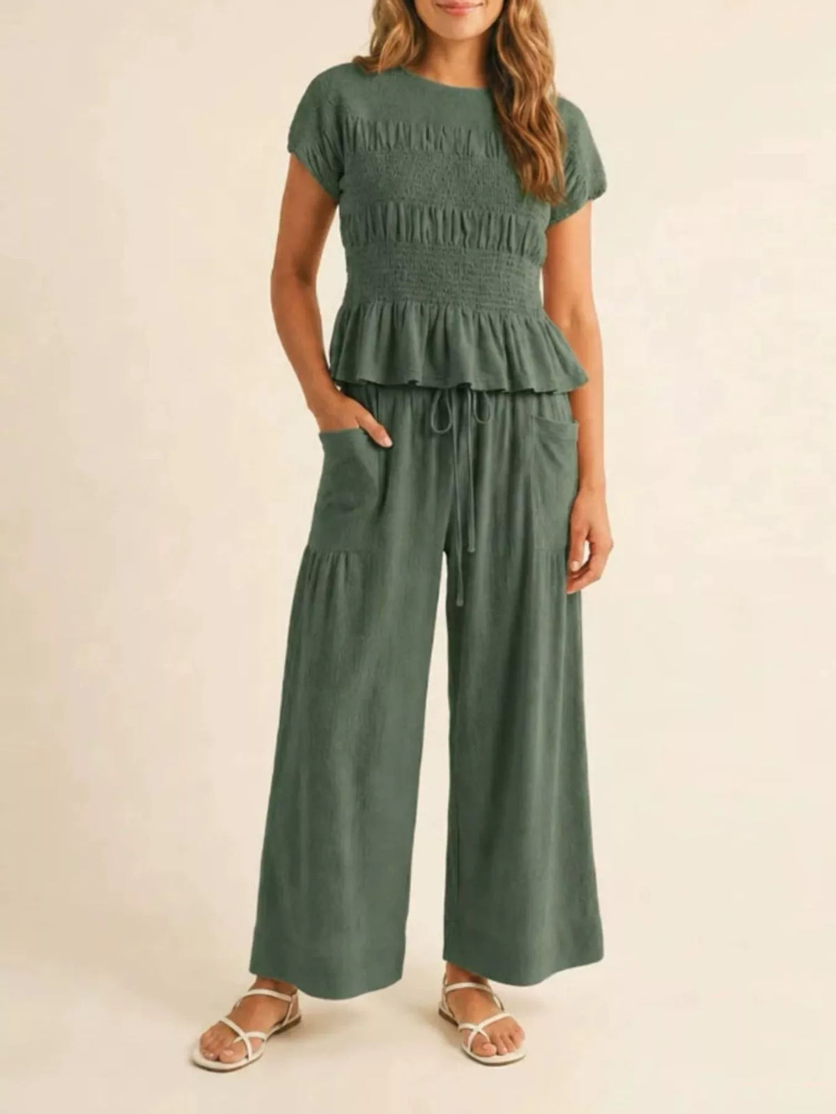 Deep green smocked peplum top and wide-leg pants set with ruffled tier and drawstring tie