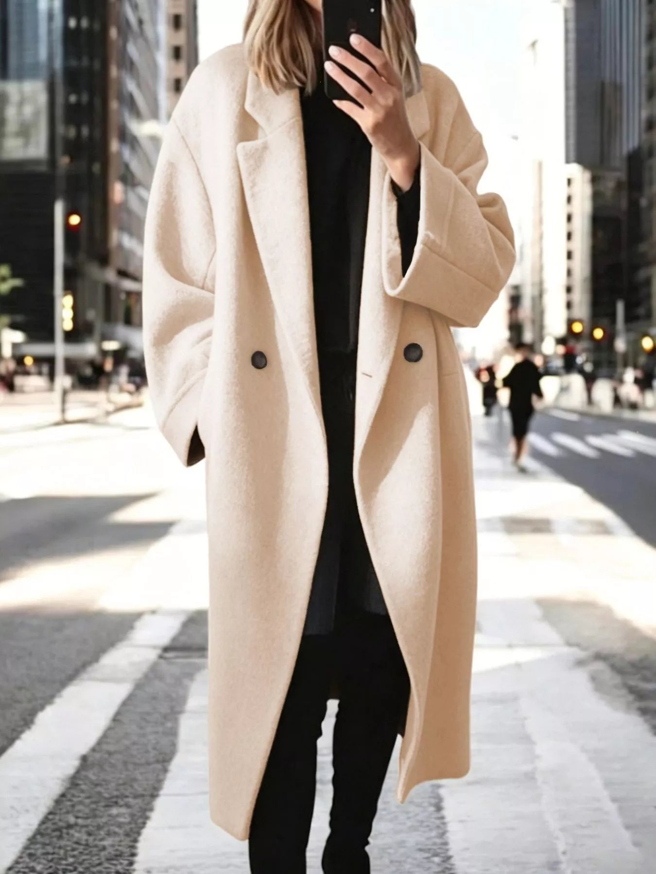 Cream longline wool-blend coat with notch lapels and double-breasted button front