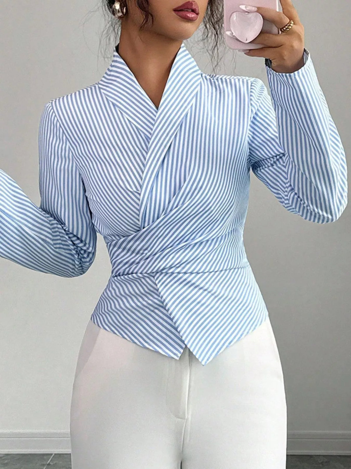 Blue striped long sleeve wrap blouse with V-neck and ruched tied waist